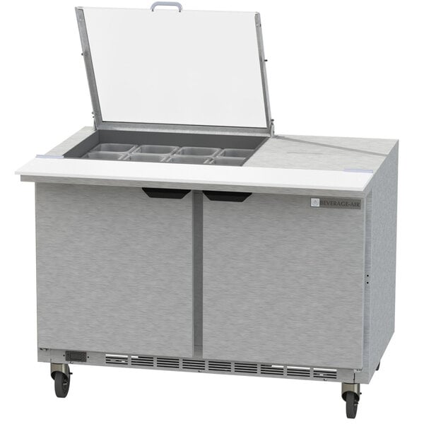 A stainless steel Beverage-Air refrigerated sandwich prep table with two sliding doors.