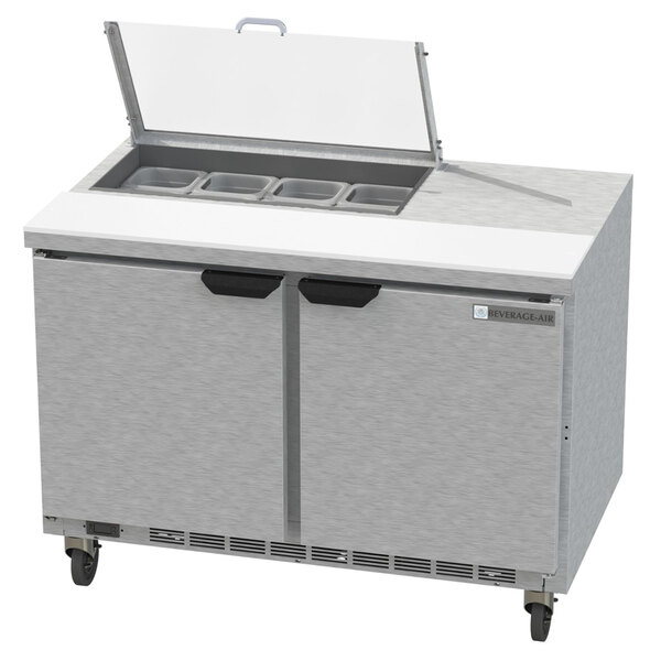 A Beverage-Air stainless steel sandwich prep table with two doors and drawers.