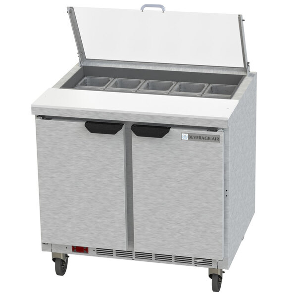 A stainless steel Beverage-Air refrigerator with two doors and two drawers above a counter.