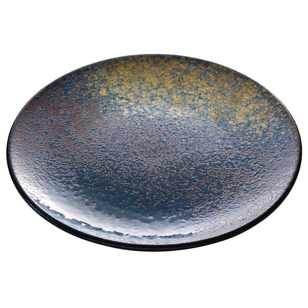 A blue and gold Playground Sea round coupe plate.