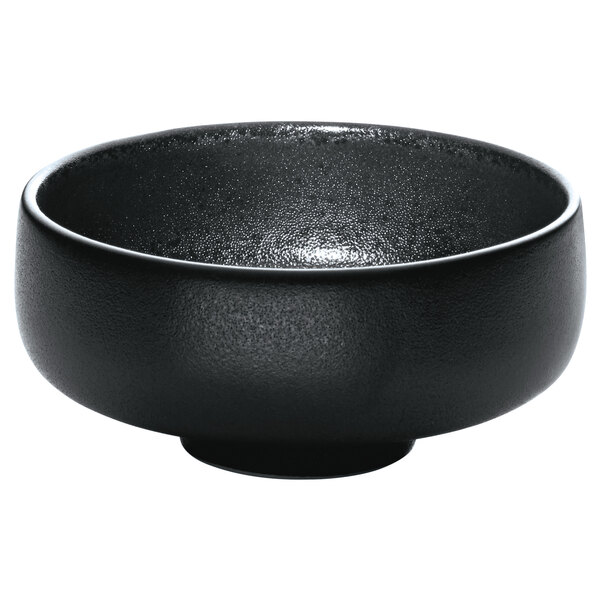 A Playground Nara black stoneware dip dish.