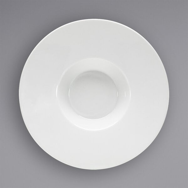 A white porcelain plate with a rim and a round center.