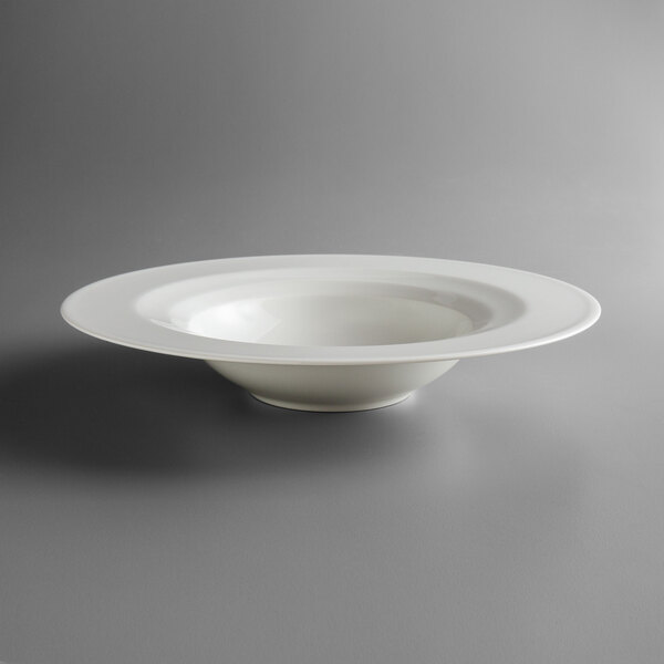 A Schonwald Allure bone white porcelain deep bowl with a rim on a white surface.