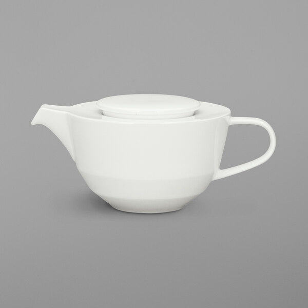 A Schonwald bone white porcelain teapot with a lid.