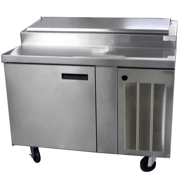 A stainless steel refrigerated pizza prep table with a door.