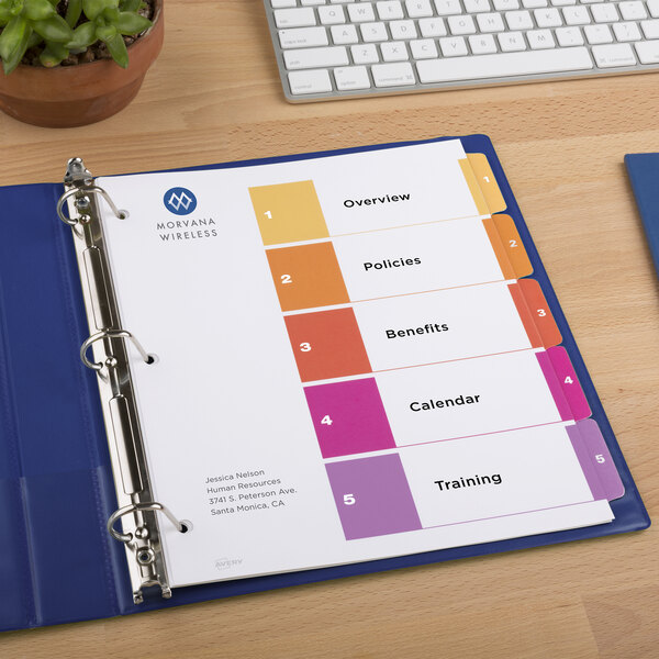 A binder with Avery multi-color customizable table of contents divider labels in it.
