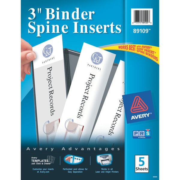 A hand inserting Avery white 3" binder spine labels.
