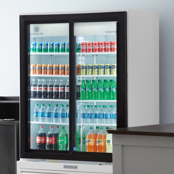 A Beverage-Air Marketeer Series refrigerated glass door merchandiser with drinks on shelves.