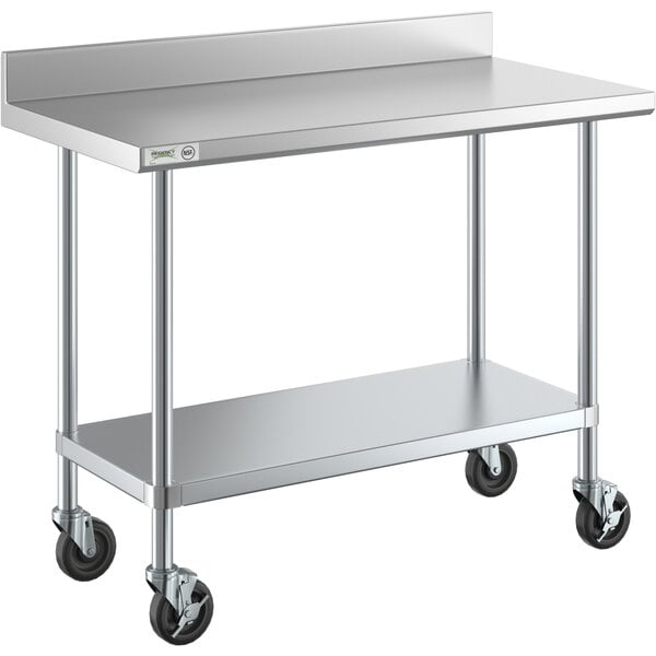 A metal work table with wheels.