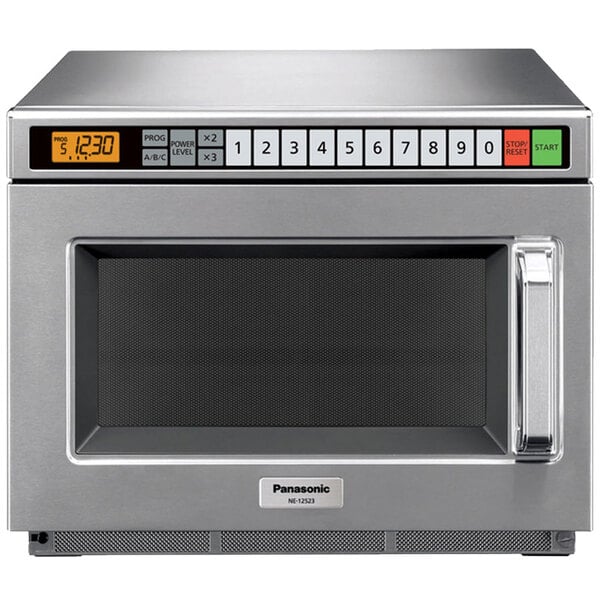 A Panasonic stainless steel commercial microwave oven with a digital display.