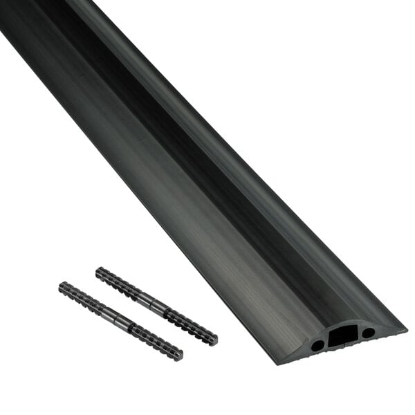 A black plastic tube with screws on a table.