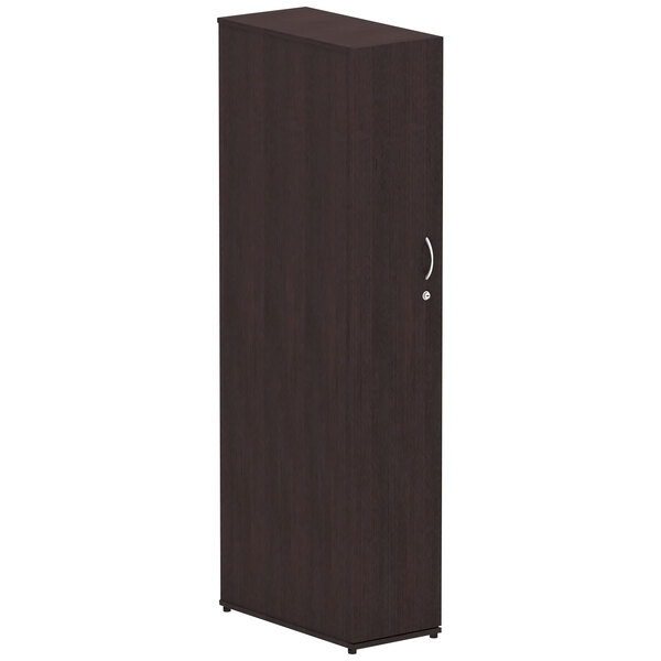 An Alera Valencia dark brown wooden wardrobe cabinet with a door.