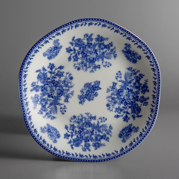 A white porcelain plate with blue and white floral designs.