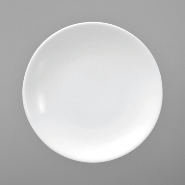 A Oneida Fusion bright white porcelain coupe plate with a white rim.