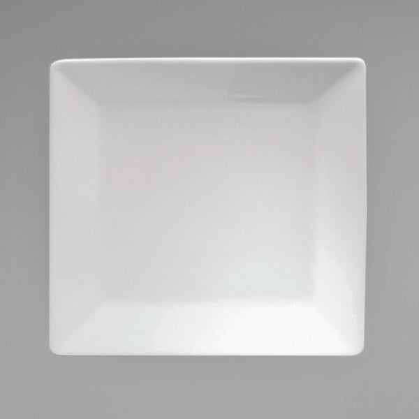 A white square Oneida Fusion porcelain plate on a grey surface.