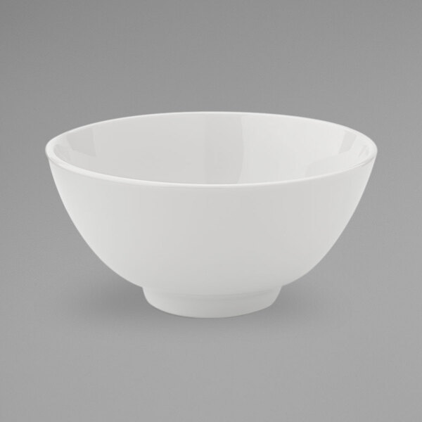 A close-up of a Oneida Fusion bright white porcelain rice bowl.