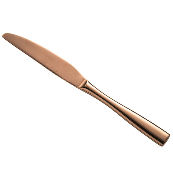 A close-up of a Bon Chef rose gold stainless steel dinner knife.