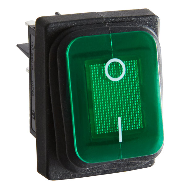 A green and white power switch with a white circle around the button.