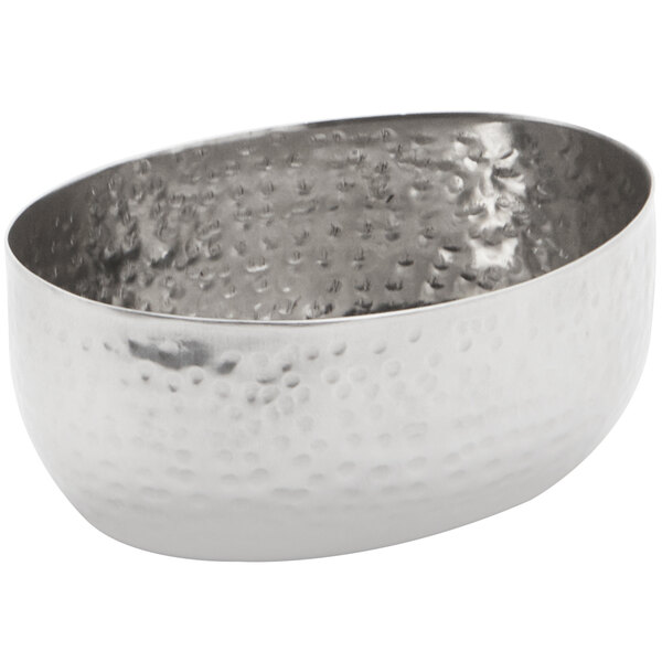 An American Metalcraft stainless steel sauce cup with a hammered surface.