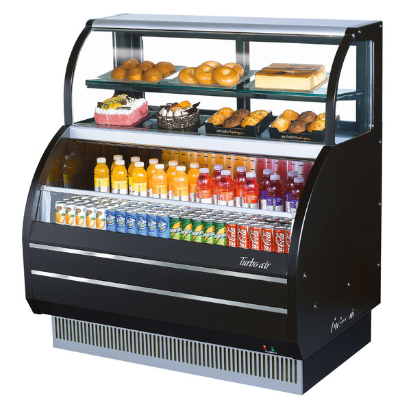 A Turbo Air black refrigerated open display case with food and drinks.
