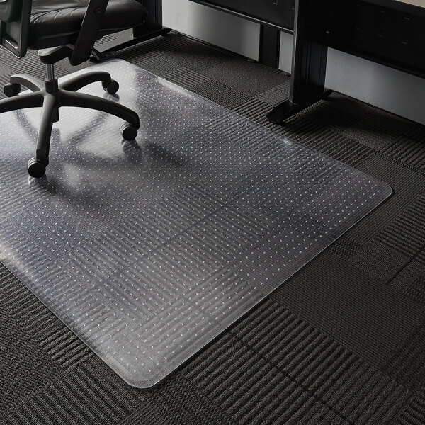A black office chair on a clear ES Robbins chair mat.