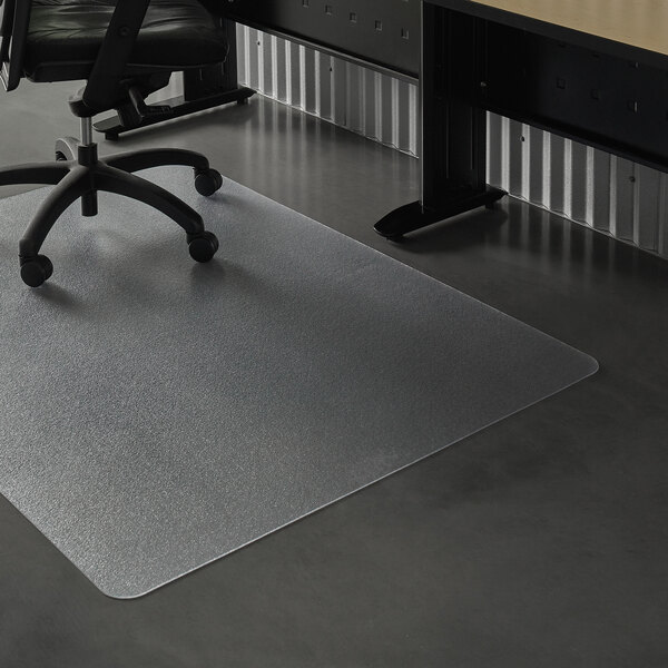 A black ES Robbins office chair on a clear vinyl rectangle chair mat.