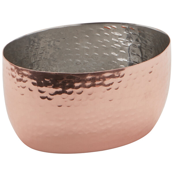 An American Metalcraft stainless steel oval sauce cup with a hammered copper finish.