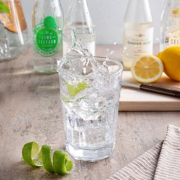 A glass of Boylan Lime Seltzer with ice and a lime wedge.