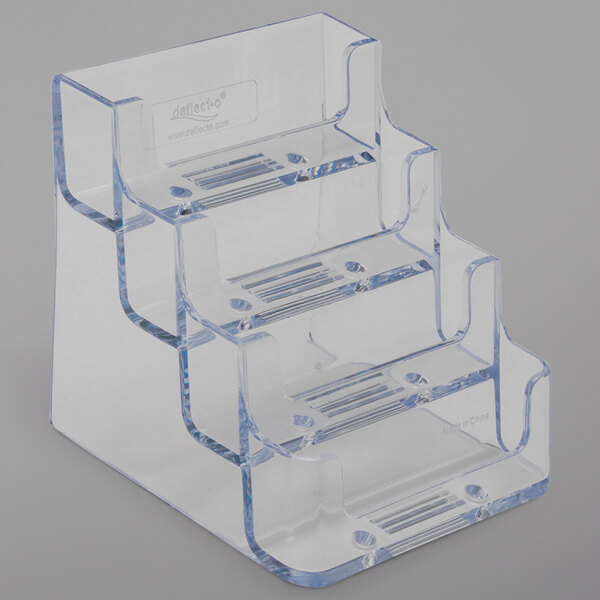 A clear plastic Deflecto business card holder with four pockets.