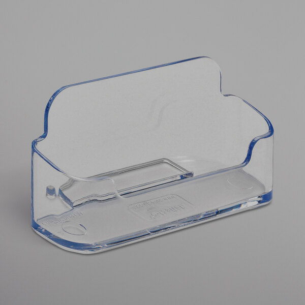 A clear plastic horizontal business card holder.
