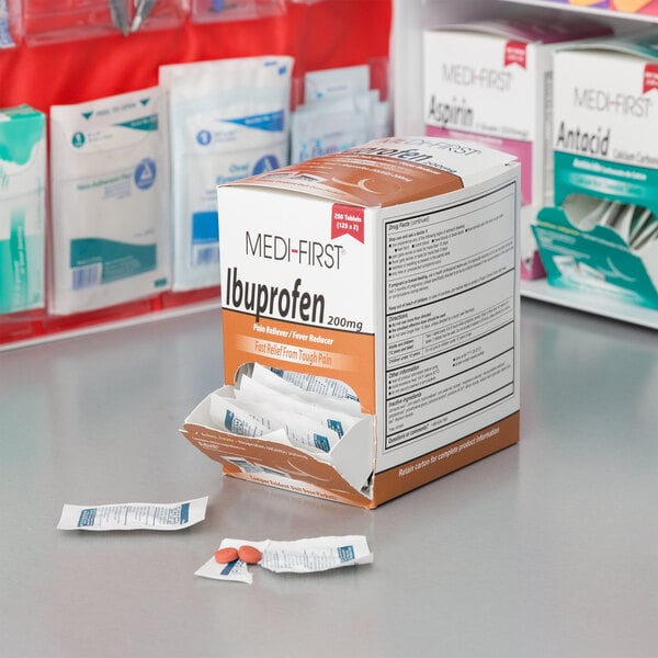 A box of Medi-First Ibuprofen tablets on a counter with a label.