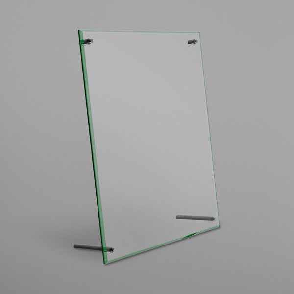 A clear glass frame with metal rods and a green border.