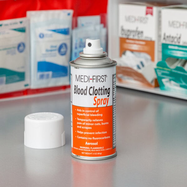 A white cylinder bottle of Medi-First blood clotting spray with a white label.