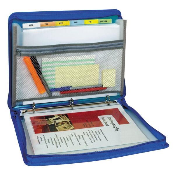 A close-up of a blue C-Line zippered binder with papers and a pencil.
