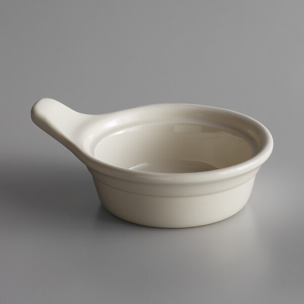 A Libbey Casablanca small white porcelain casserole dish with a handle.