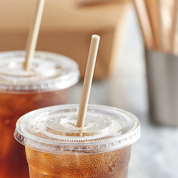 Two plastic cups of drinks with EcoChoice Kraft paper straws on a table.