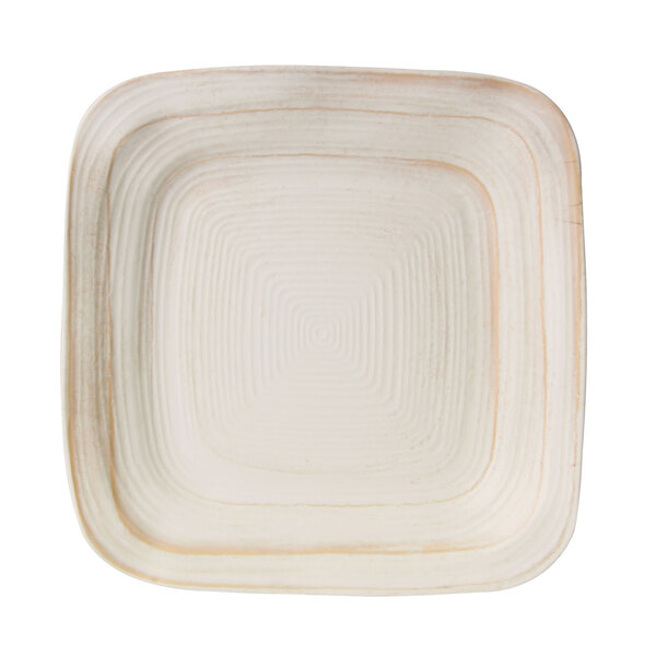 An Elite Global Solutions Della Terra melamine square plate with an off white irregular square with a brown border.