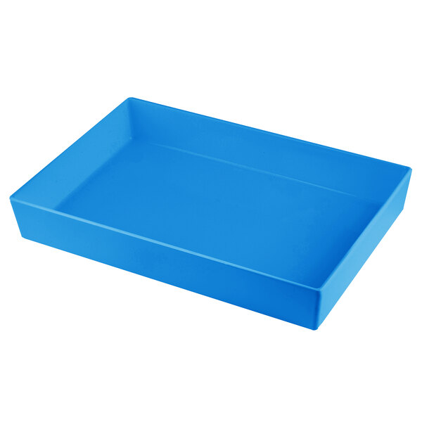 A sky blue rectangular Tablecraft bowl on a counter in a salad bar.