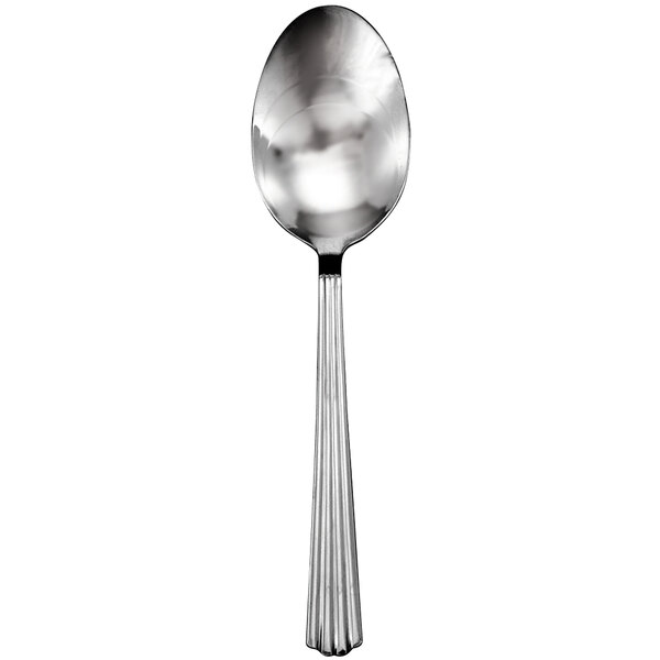 A Walco stainless steel serving spoon with a long handle.