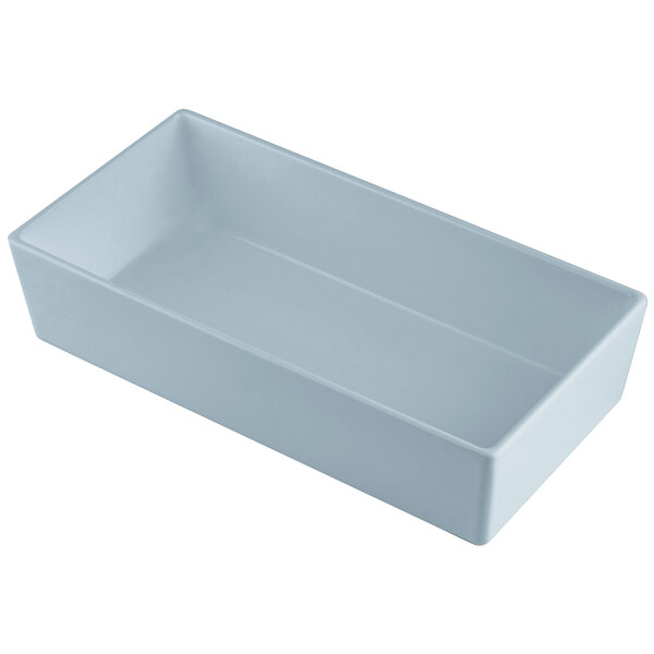 A Tablecraft gray cast aluminum 1/3 size straight sided bowl on a white counter.