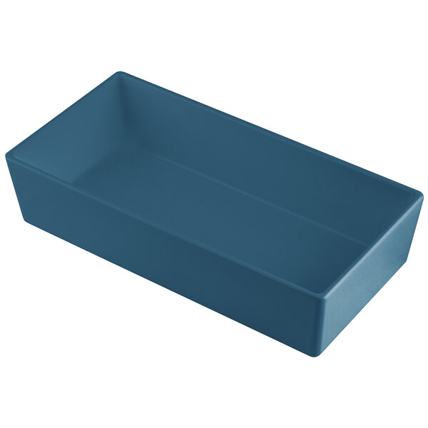 A blue rectangular Tablecraft cast aluminum bowl on a counter.