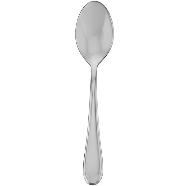 A close-up of a Walco stainless steel dessert spoon with a handle.