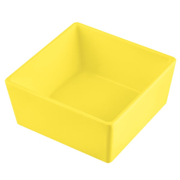 A yellow square Tablecraft bowl with straight sides.