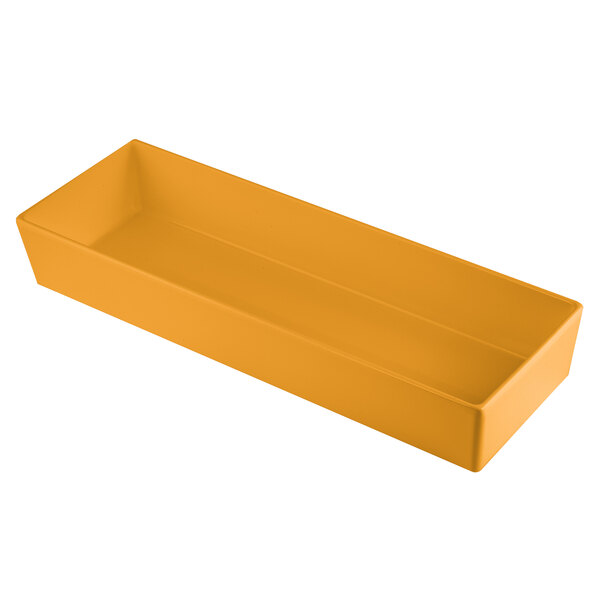 A rectangular orange cast aluminum bowl with straight sides.