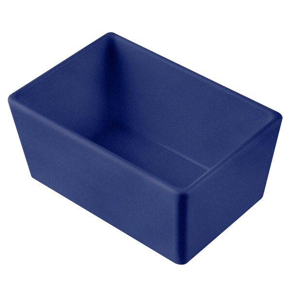 A Tablecraft blue rectangular cast aluminum bowl with a blue speckled finish on a counter.
