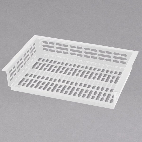 A white Tablecraft plastic drop-in well template with holes.