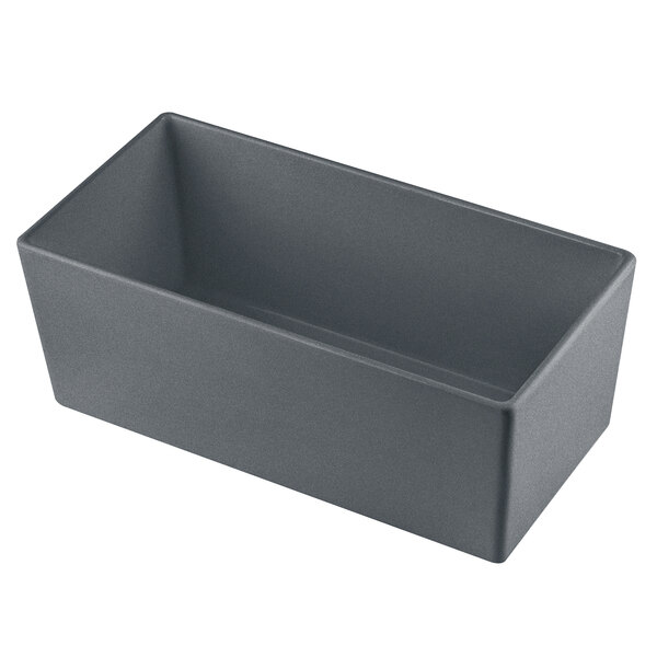 A Tablecraft granite cast aluminum rectangular bowl with straight sides on a counter.