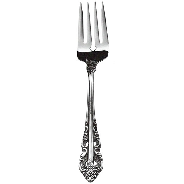A close-up of a Walco stainless steel salad fork with a Baroque pattern on the handle.