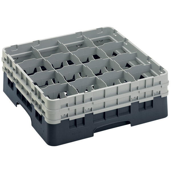A black plastic Cambro glass rack with 16 compartments.