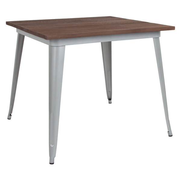 A Flash Furniture square dining table with a silver metal frame and rustic walnut wood top.